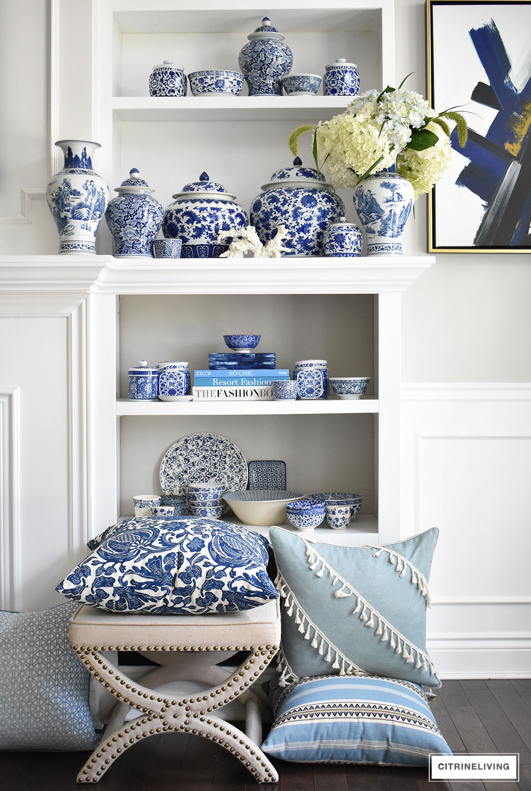 blue and white chinoiserie collection ginger jars vases bowls dishes uphlstered stool white bookshelves pillows